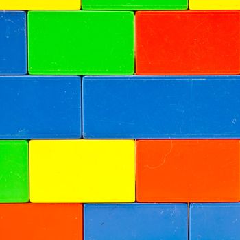 Background of plastic building blocks.  Bright colors.