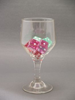  glass cup with dice
