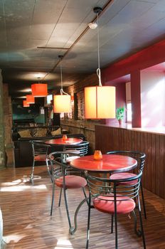 Shot of tables and chairs in billiard room