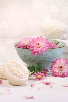 Spa scene with  chrysanthemum flowers in water and soap