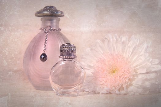 Vintage perfume bottles with flower and soap