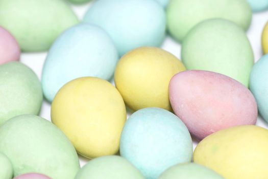 Colorful pastel color easter egg candy background.
