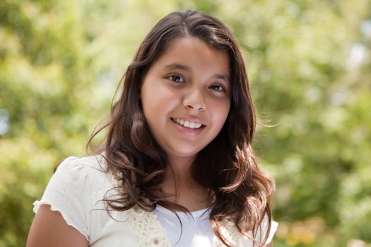 Cute Happy Hispanic Girl in the Park.