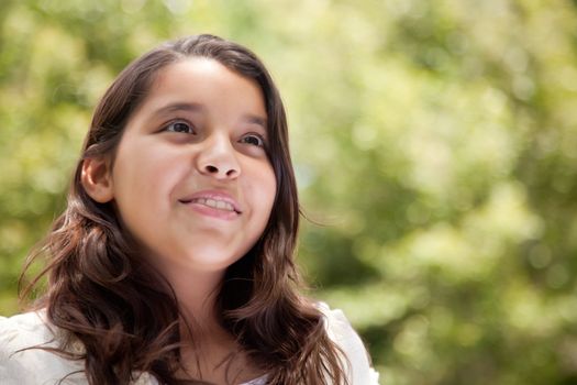 Cute Happy Hispanic Girl in the Park.