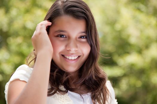 Cute Happy Hispanic Girl in the Park.