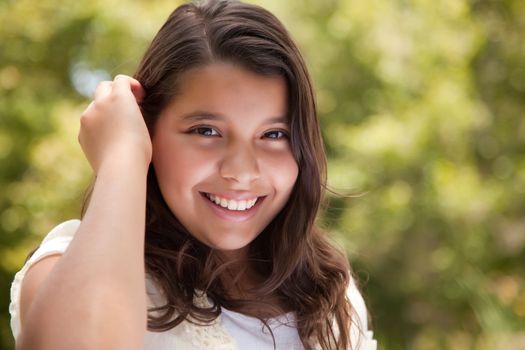 Cute Happy Hispanic Girl in the Park.