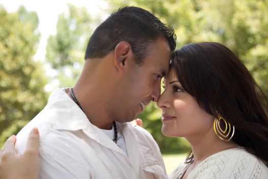 Affectionate Happy Hispanic Couple in the Park.