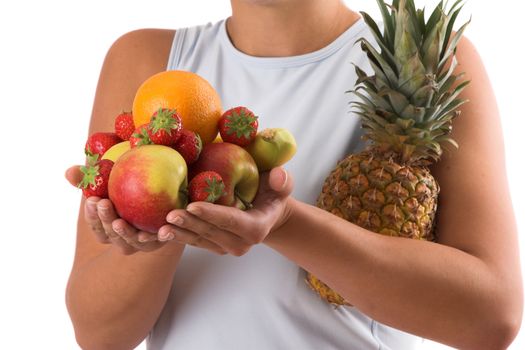 Woman with her hands full of healthy fruit