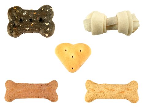 Assortment of different dog treats isolated over a white background