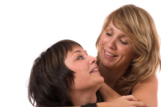 Two sisters looking at eachother smiling