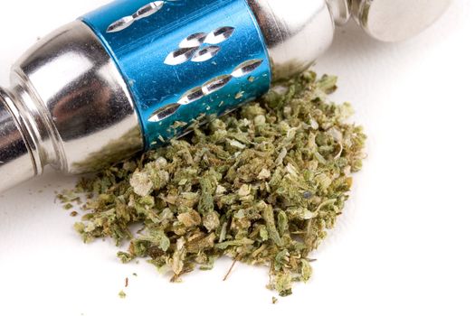 Marijuana pipe closeup with pot on the front