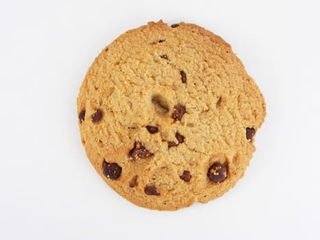 Chocolate chip cookie against an off-white background.