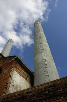 Two factory chimneys on the Venetian island of Murano, where glass is made.