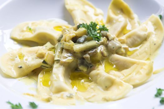 Pasta dish with courgette, mushrooms, cream and a little bit of parsley