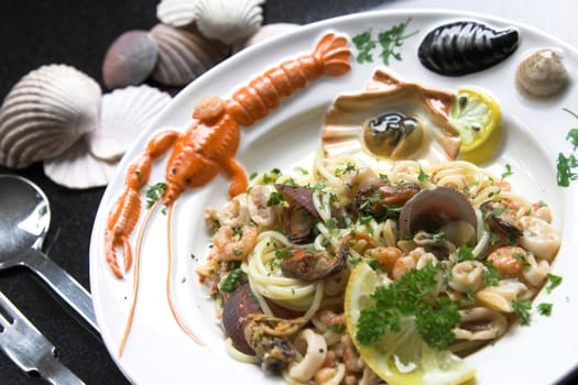 Beautiful seafood dish made with spaghetti, mussels, squid and shrimps