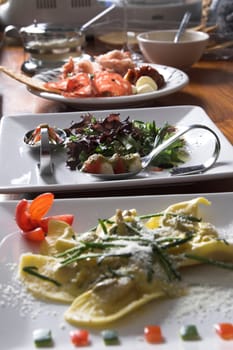 Three plates with food waiting to be served