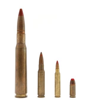 Four red-tipped tracer cartridges of various calibers isolated