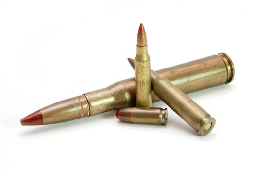 Pile of red-tipped tracer cartridges of various calibers isolated