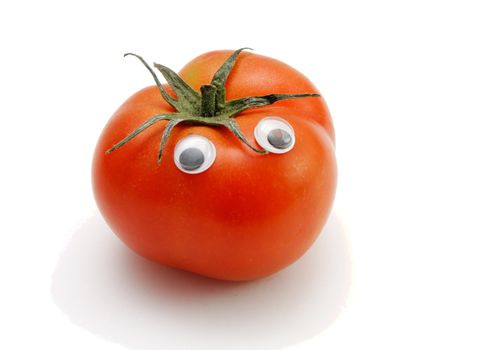 Funny red tomato with eyes on white background