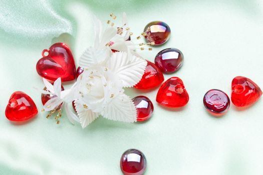 red decoration, artificial flower, pebbles and heart for valentine day