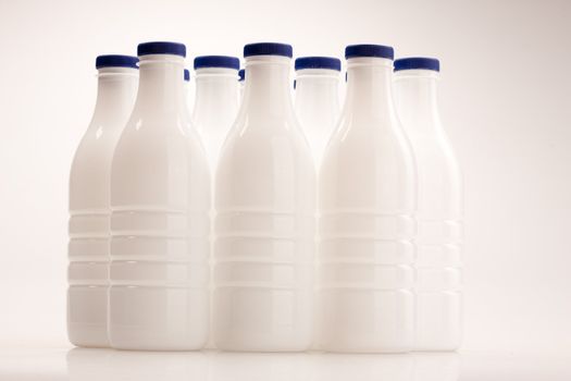 food series: white plastic milk bottle over white