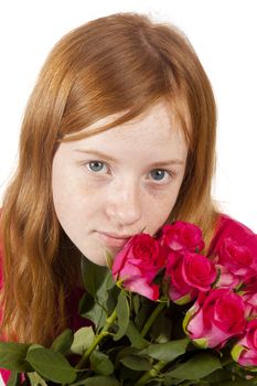 Little girl is holding pink roses