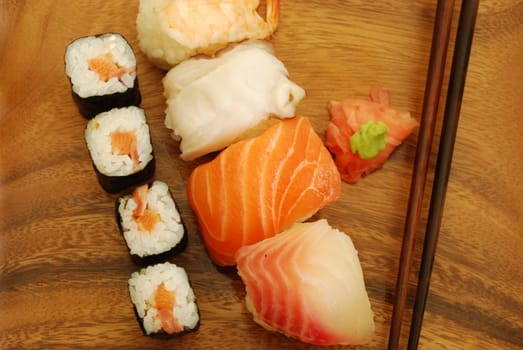 sushi meal with nigiris/makis (salmon, swordfish, shrimp, octupus) and chopsticks