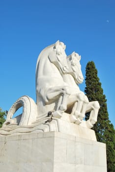 photo of a sculpture statue of horses in a park in Lisbon