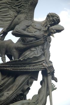 detail photo of Peace Fountain next to Cathedral of Saint John the Divine, Manhattan, New York, USA. This controversial sculpture depicts the struggle between good and evil.