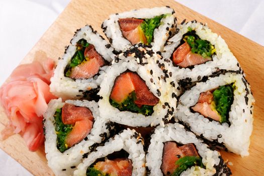Sushi rolls with tuna and green onion top view