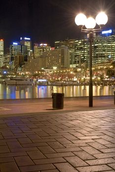 lighted Darling Harbour at night vertical photo, Sydney, Australia