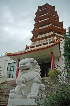 Pagoda and a dragon-dog sculpture in Nan Tien Temple complex, Sydney, Australia