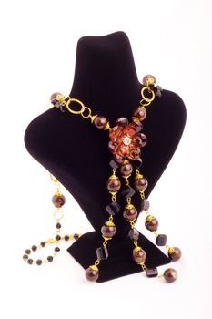 Elegant necklace on black mannequin stand