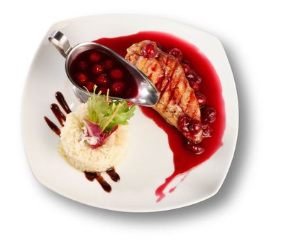 Delicious beef with cherry sauce. File includes clipping path for easy background removing