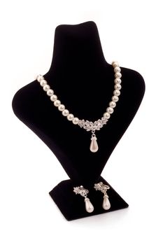 Pearl necklace on black stand