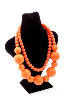 Orange color necklace on black Mannequin