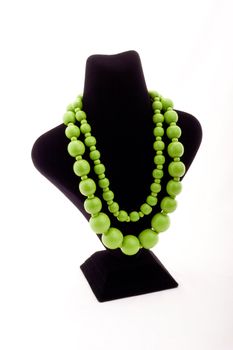 Green necklace on black Mannequin