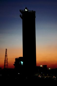 Silloute of light house in the city of Southern India