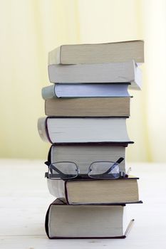books stack and glasses