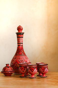 Still-life on table with decorated Moroccan pottery - vertical and shallow debt of field