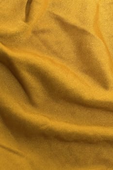 crumpled golden fabric detail photo, can be used as a background