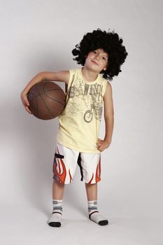 Boy standing wit a ball