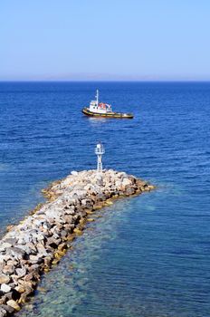 Travel photography: Boat and beacon in the Mediterranean Sea