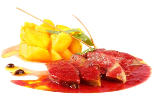 Pork with cherry sauce and pineapple on white background