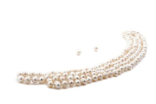 Pearl necklace look like a smile on white background 
