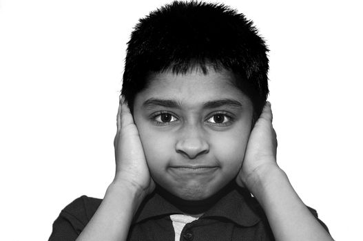 An handsome Indian kid looking very stubborn