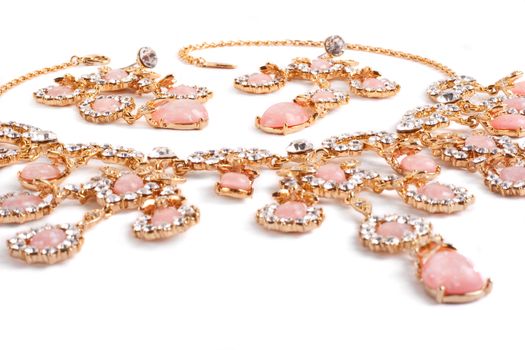 Diamond pendant with pink gems. Closeup