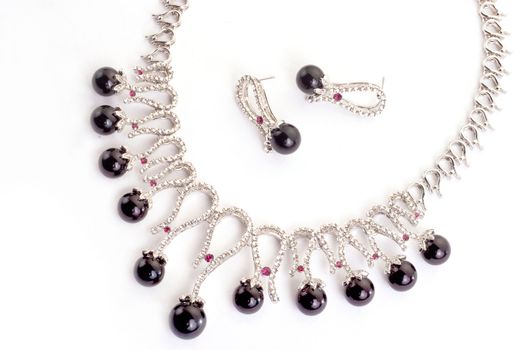 Necklace with black pearls on a white background