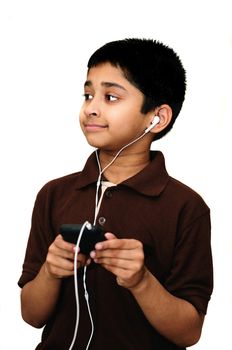 An handsome Indian kid listening to music happily