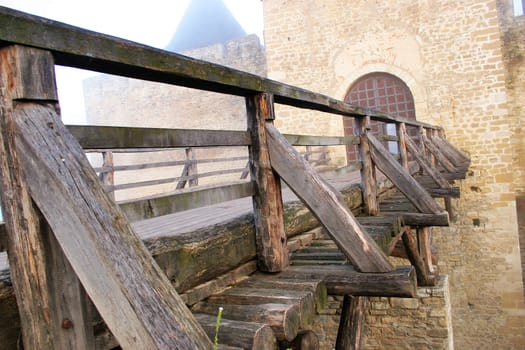 Bridge of an ancient castle in a fog